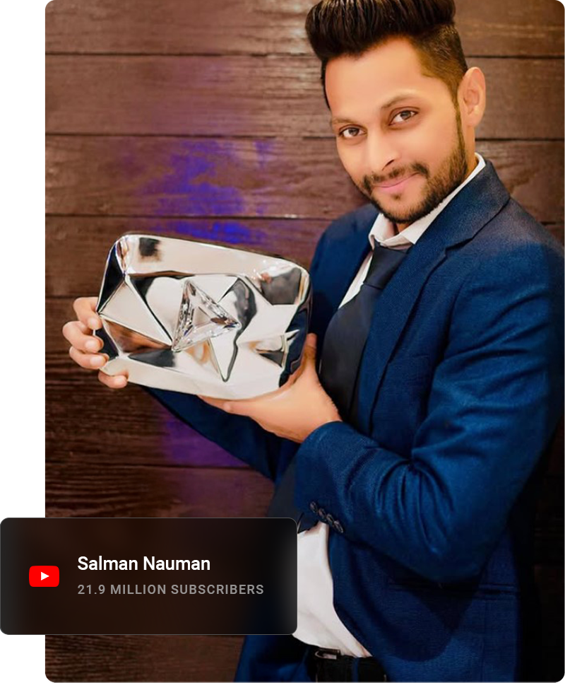 Youtube influencer looking away from the camera and smiling while sitting on a curb.
